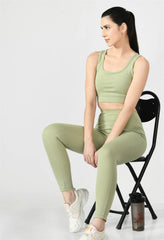Waylene Pista Green Track Suit with Sleeveless Crop Top and High-Waisted Leggings, Seated Pose