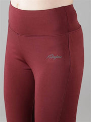 Close-up of Waylene wine color capri tights with logo detail