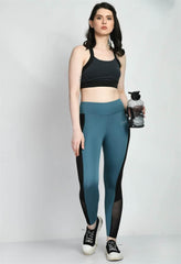 Waylene Air Force Blue Tights, front view with model holding a water bottle