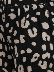 Close-up of Waylene Printed Shorts, black with beige abstract pattern.