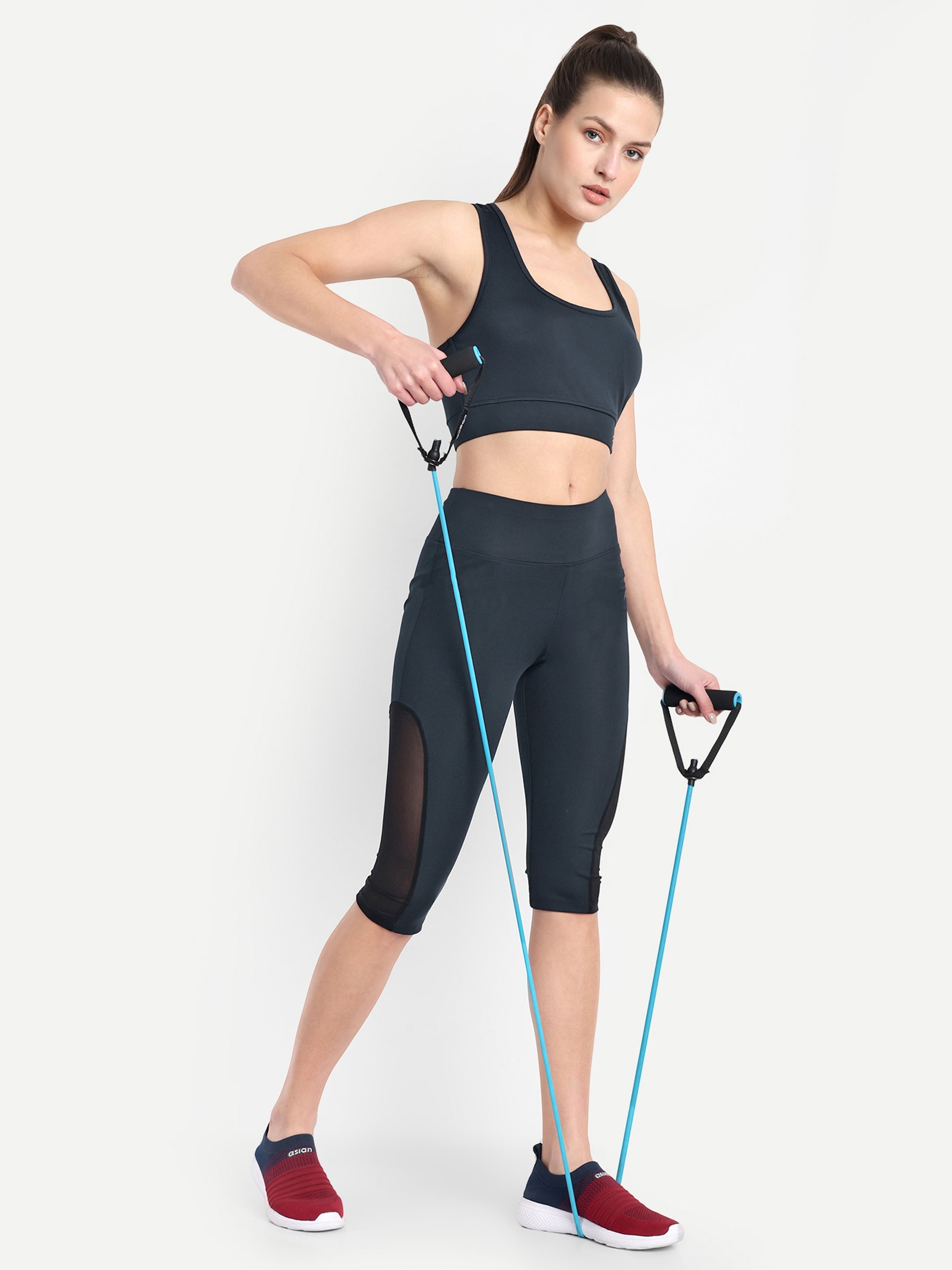 Waylene Women's Navy Blue High-Waisted Sports Capris with Mesh Panels, workout pose with resistance band
